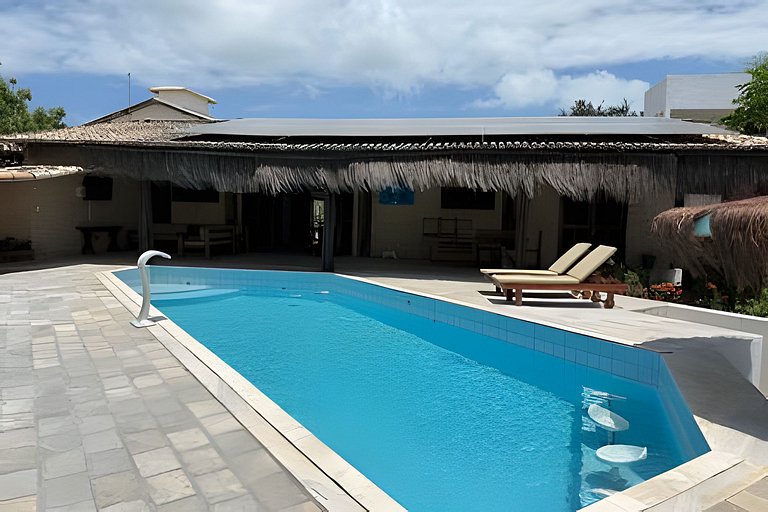 House with a pool and barbecue area in Tibau do Sul.