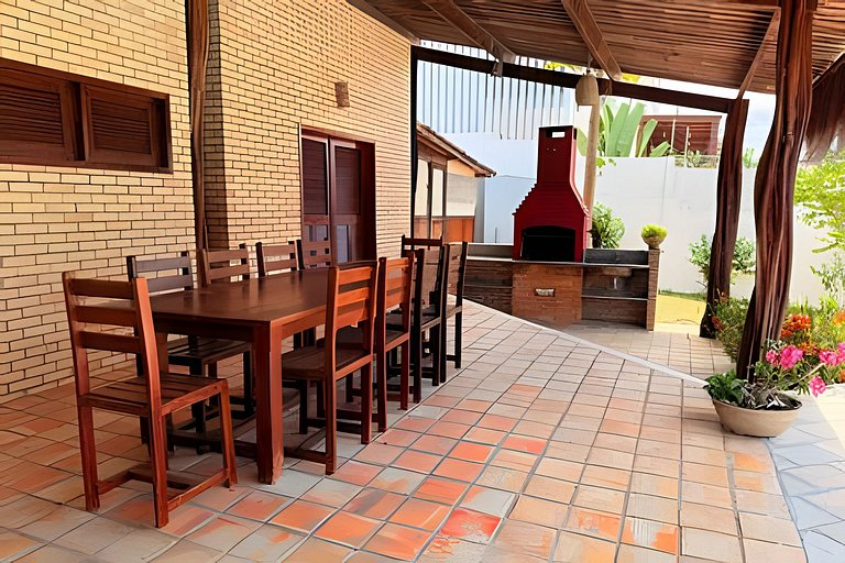 House with a pool and barbecue area in Tibau do Sul.