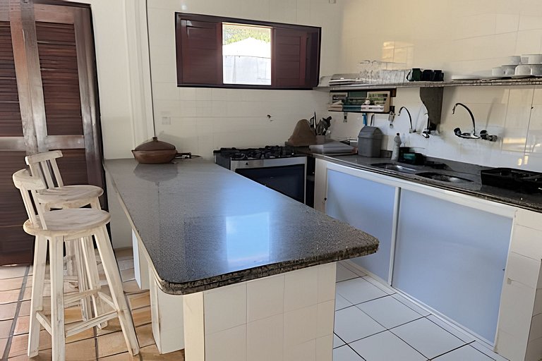 House with a pool and barbecue area in Tibau do Sul.