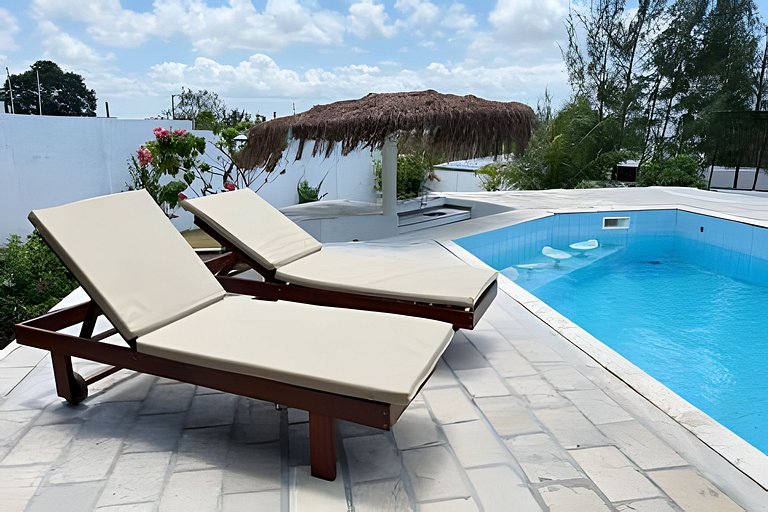 House with a pool and barbecue area in Tibau do Sul.