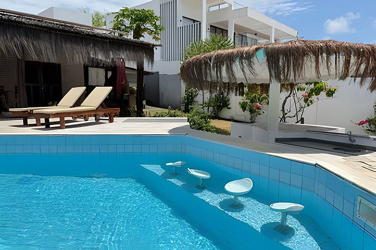 House with a pool and barbecue area in Tibau do Sul.
