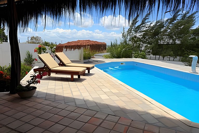House with a pool and barbecue area in Tibau do Sul.