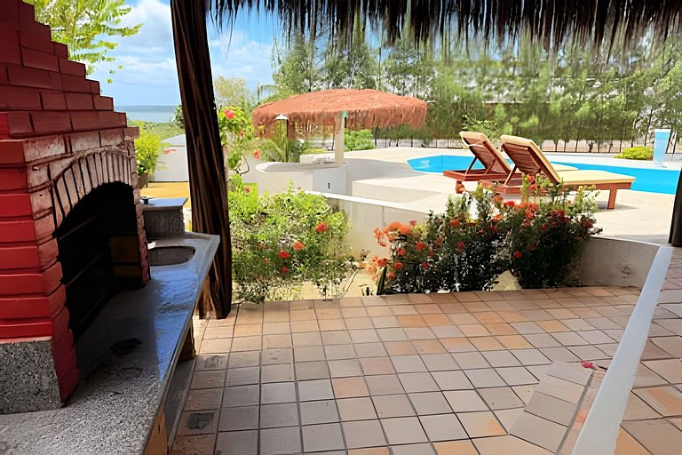 House with a pool and barbecue area in Tibau do Sul.