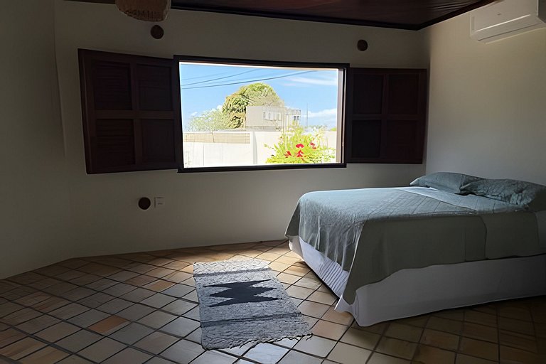 House with a pool and barbecue area in Tibau do Sul.