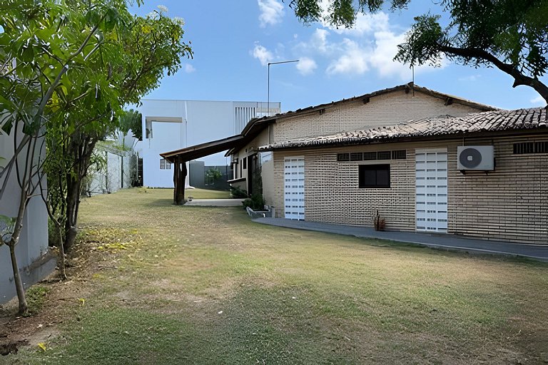 House with a pool and barbecue area in Tibau do Sul.