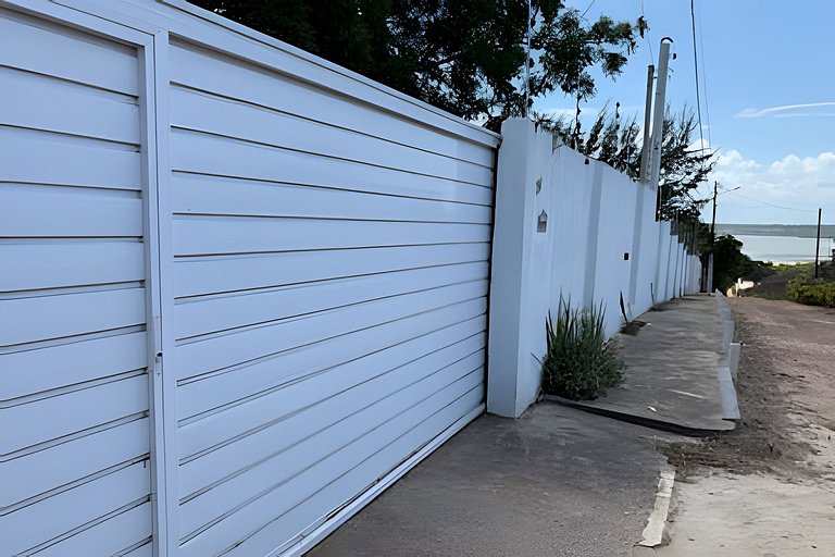 House with a pool and barbecue area in Tibau do Sul.