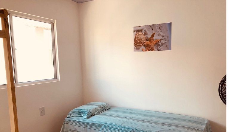 Casa em condomínio com acesso à piscina e churrasqueira, Mar